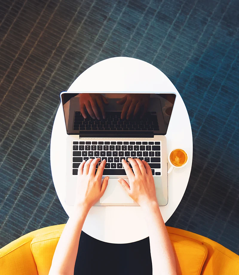 A person working on their laptop computer